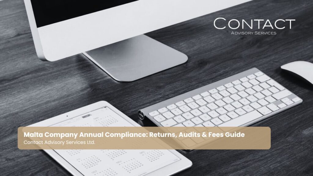 A computer and calendar page showing a full year, for key compliance dates